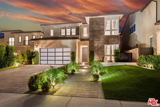 a room with a sink cabinets and a window