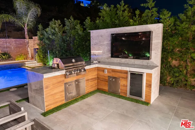 a bathroom with a shower sink vanity mirror and toilet