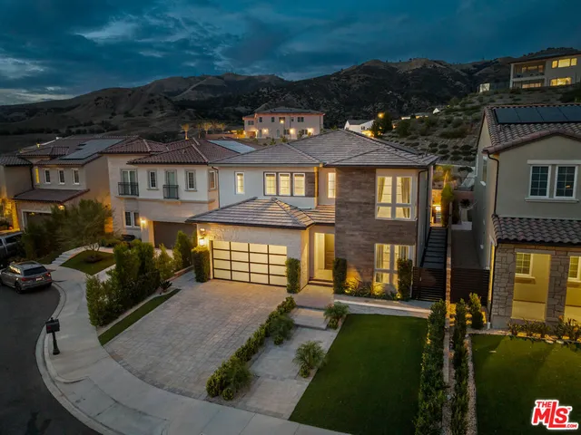 a bathroom with a granite countertop sink toilet a mirror and shower