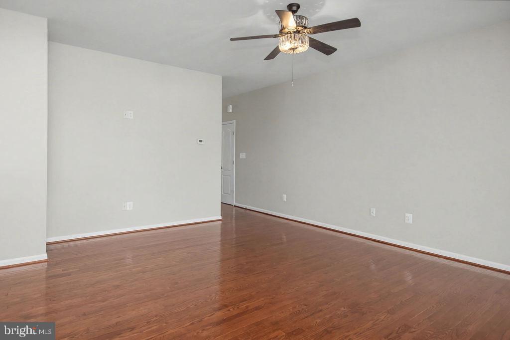 137 Silver Maple Road Middletown, DE 19709 - Photo 7 of 21 a view of an empty room with a fan