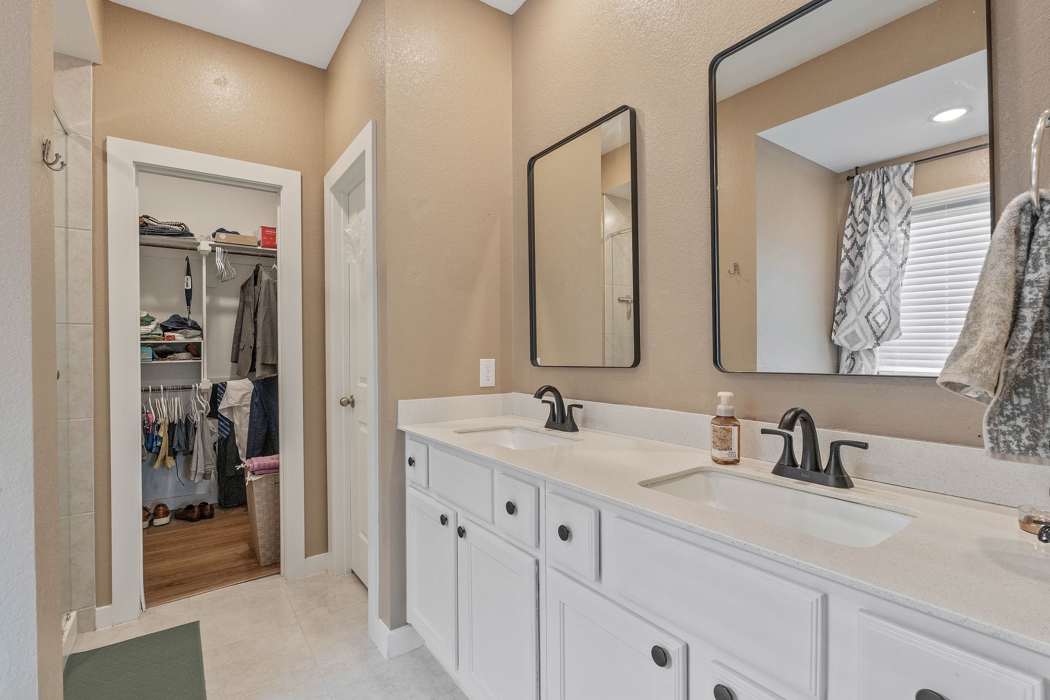 509 Timber Voyage Court Conroe, TX 77304 - Photo 23 of 36 a bathroom with a double vanity sink and a mirror