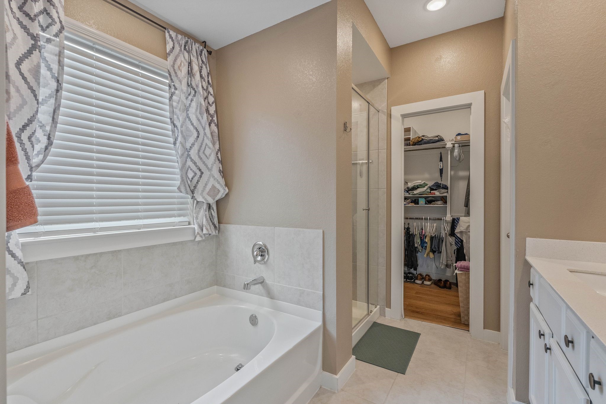 509 Timber Voyage Court Conroe, TX 77304 - Photo 24 of 36 a bathroom with a bathtub and a shower