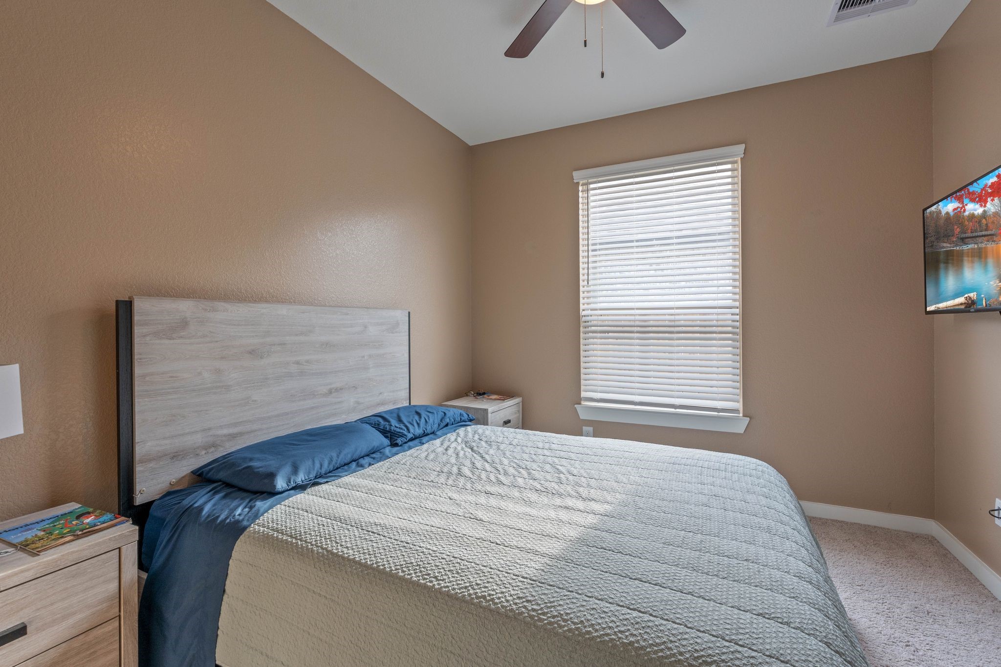 509 Timber Voyage Court Conroe, TX 77304 - Photo 27 of 36 a bedroom with a bed and a window