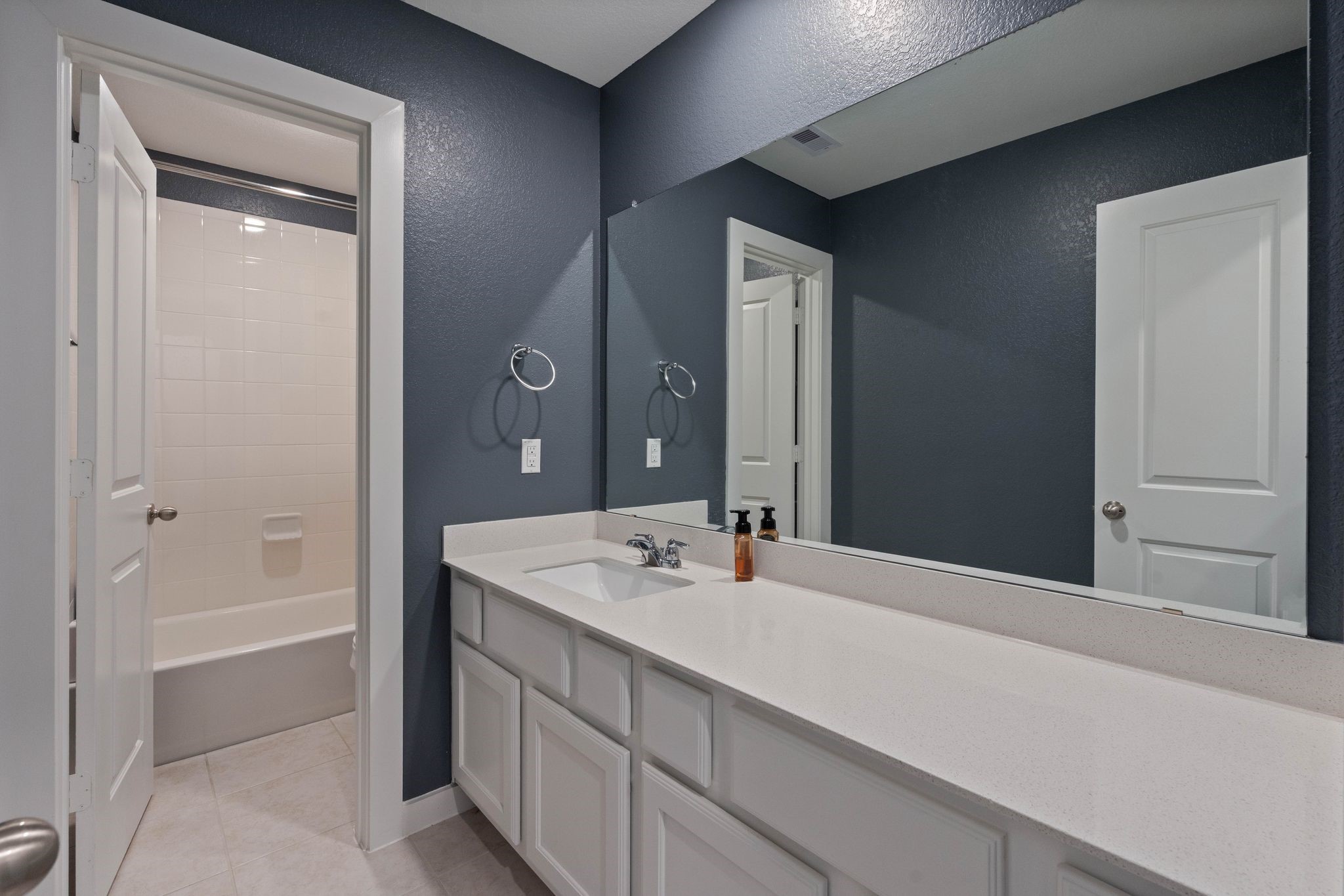 509 Timber Voyage Court Conroe, TX 77304 - Photo 30 of 36 a bathroom with a sink and a mirror