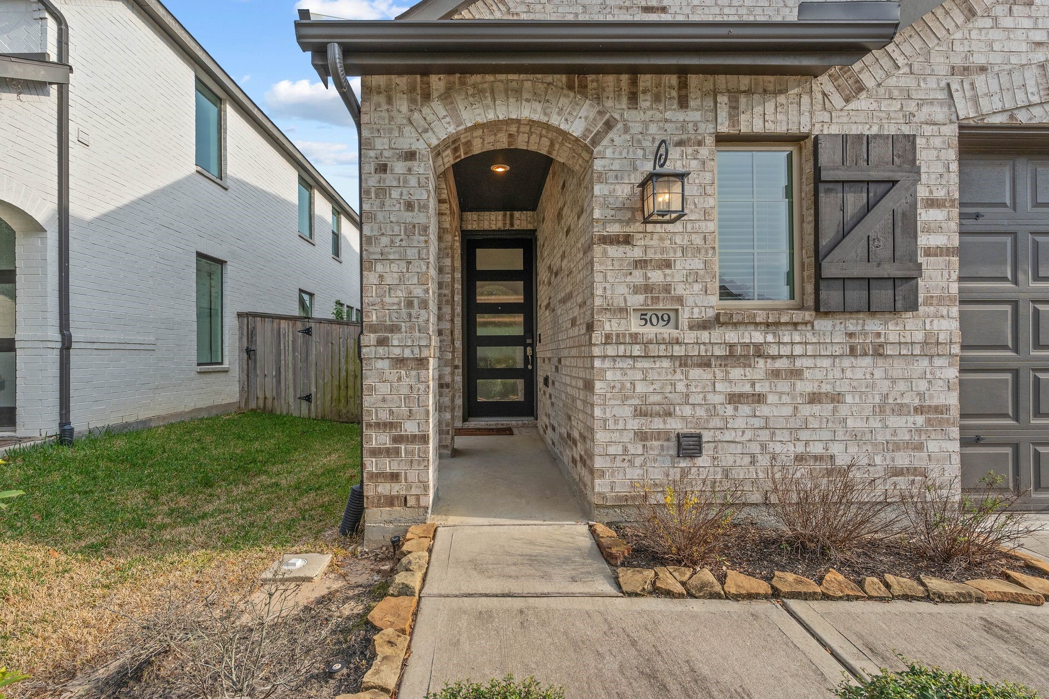 509 Timber Voyage Court Conroe, TX 77304 - Photo 3 of 36 a front view of a house with garden
