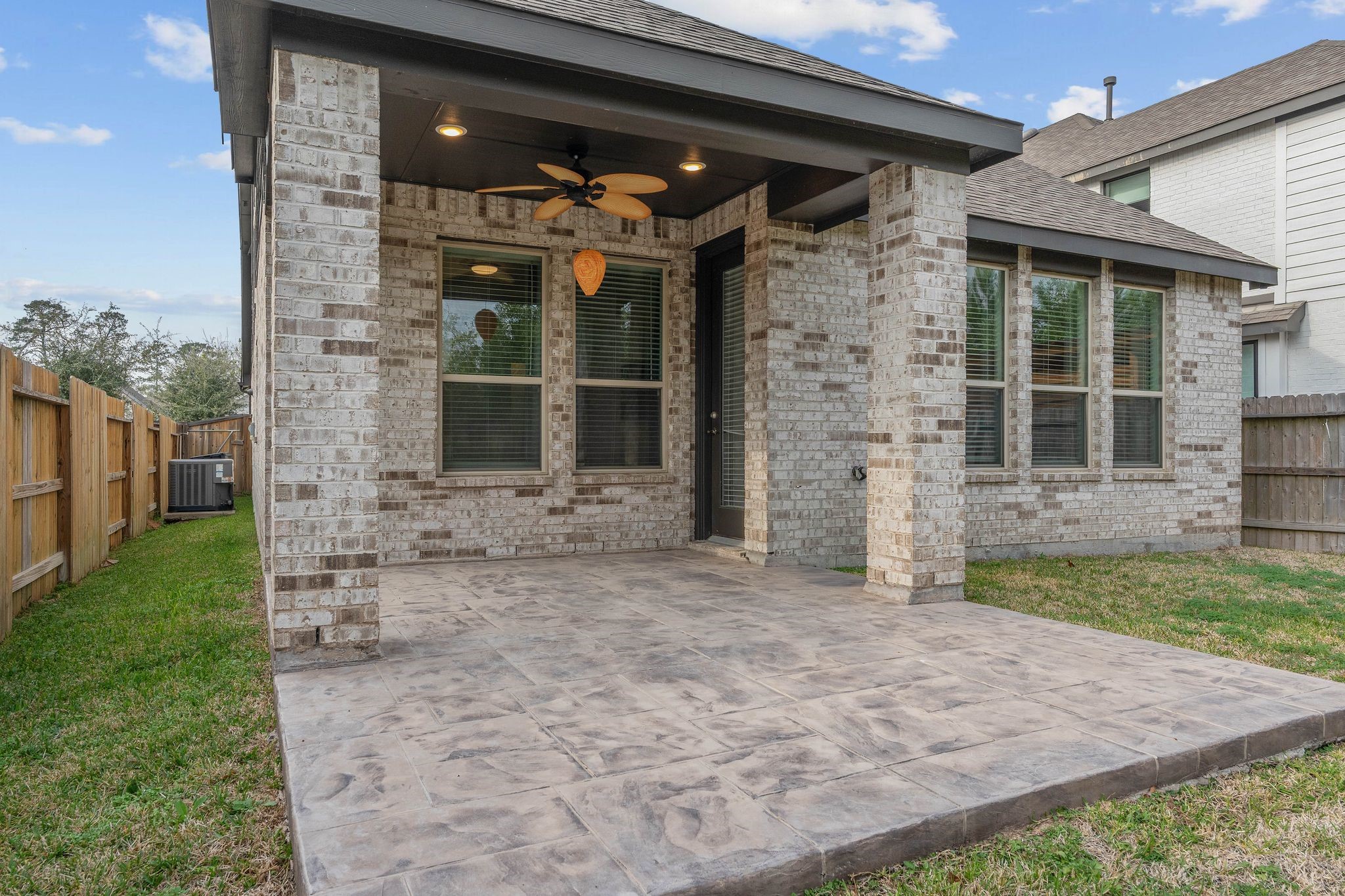 509 Timber Voyage Court Conroe, TX 77304 - Photo 33 of 36 a view of a brick house with a large door