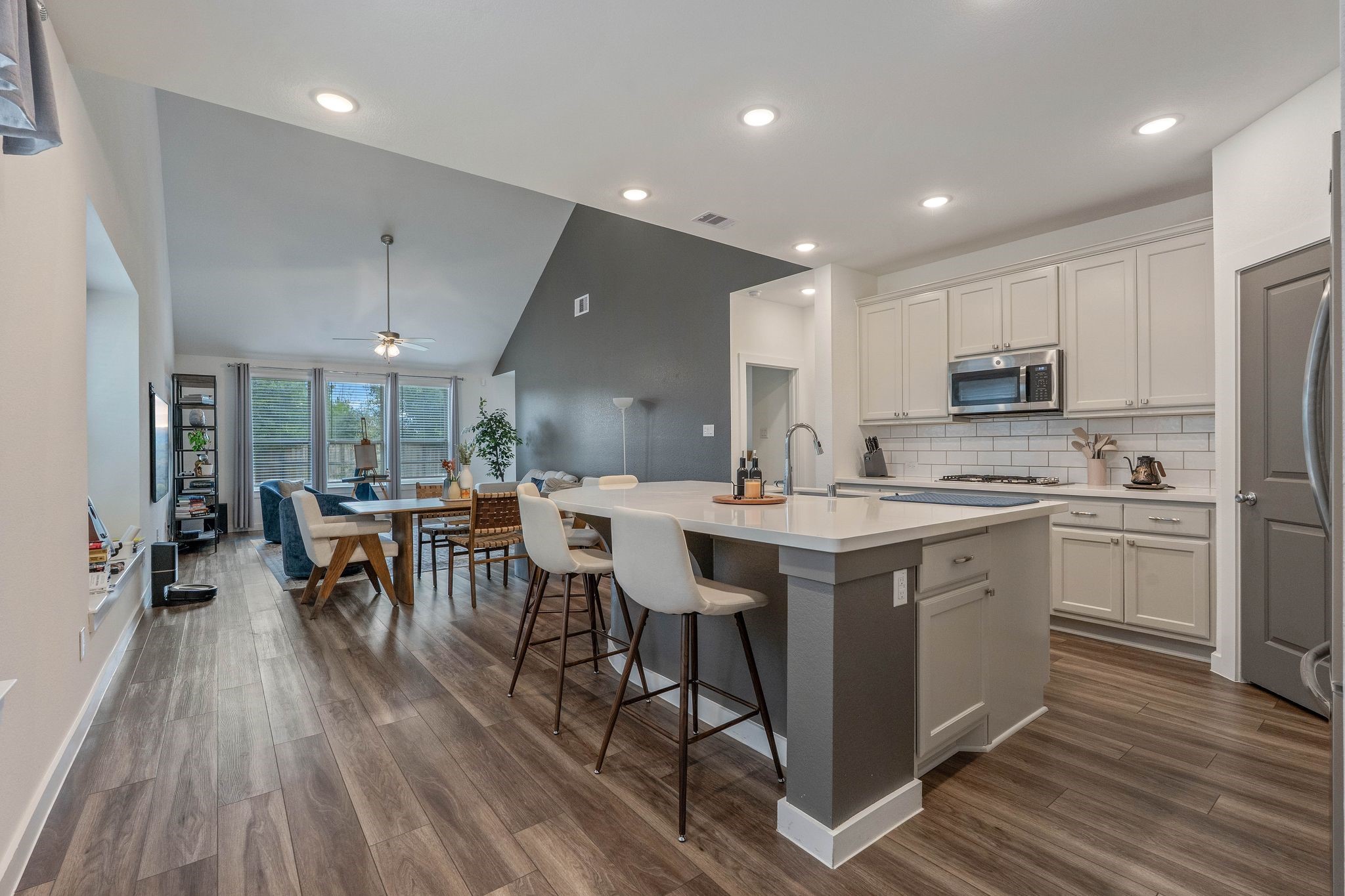 509 Timber Voyage Court Conroe, TX 77304 - Photo 8 of 36 a kitchen with a sink microwave and cabinets