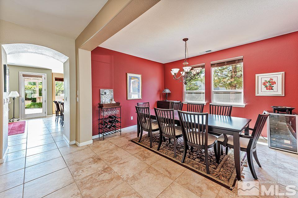 580 Secretariat Court Reno, NV 89521 - Photo 6 of 25 a view of a dining room with furniture window and outside view