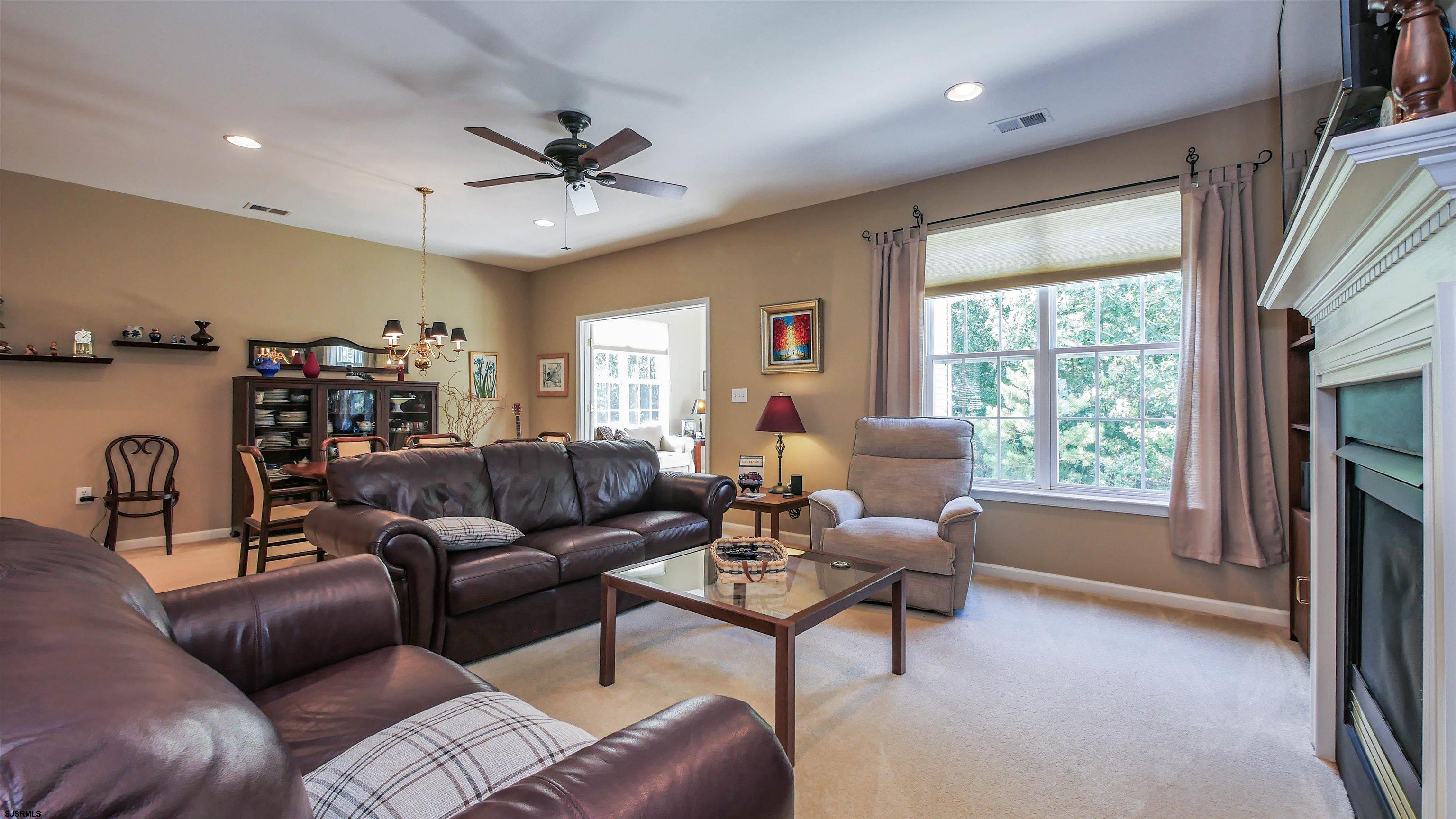 33 Brampton Street Smithville, NJ 08205 - Photo 16 of 37 a living room with furniture and a large window