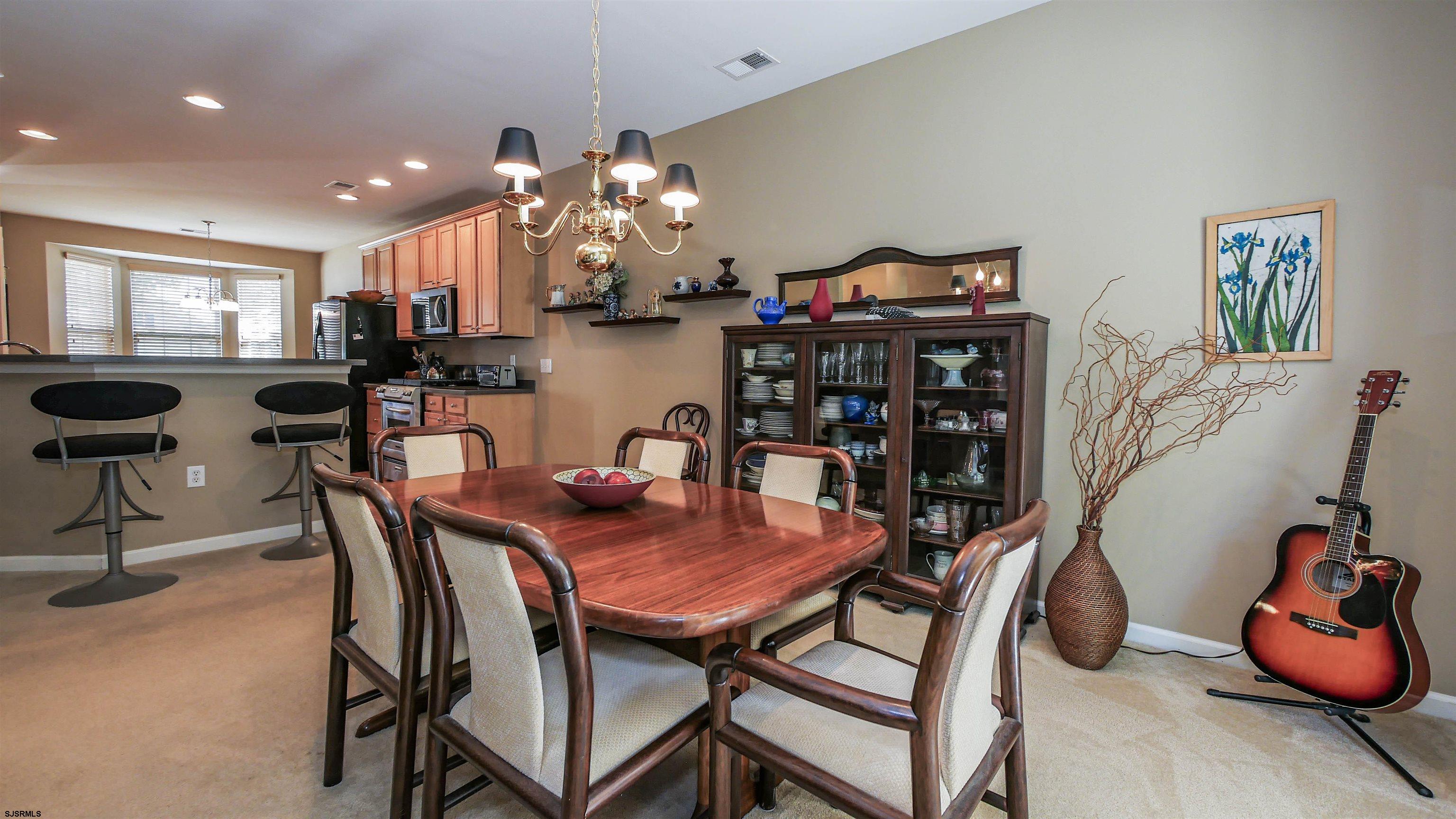 33 Brampton Street Smithville, NJ 08205 - Photo 18 of 37 a view of a dining room with furniture and chandelier