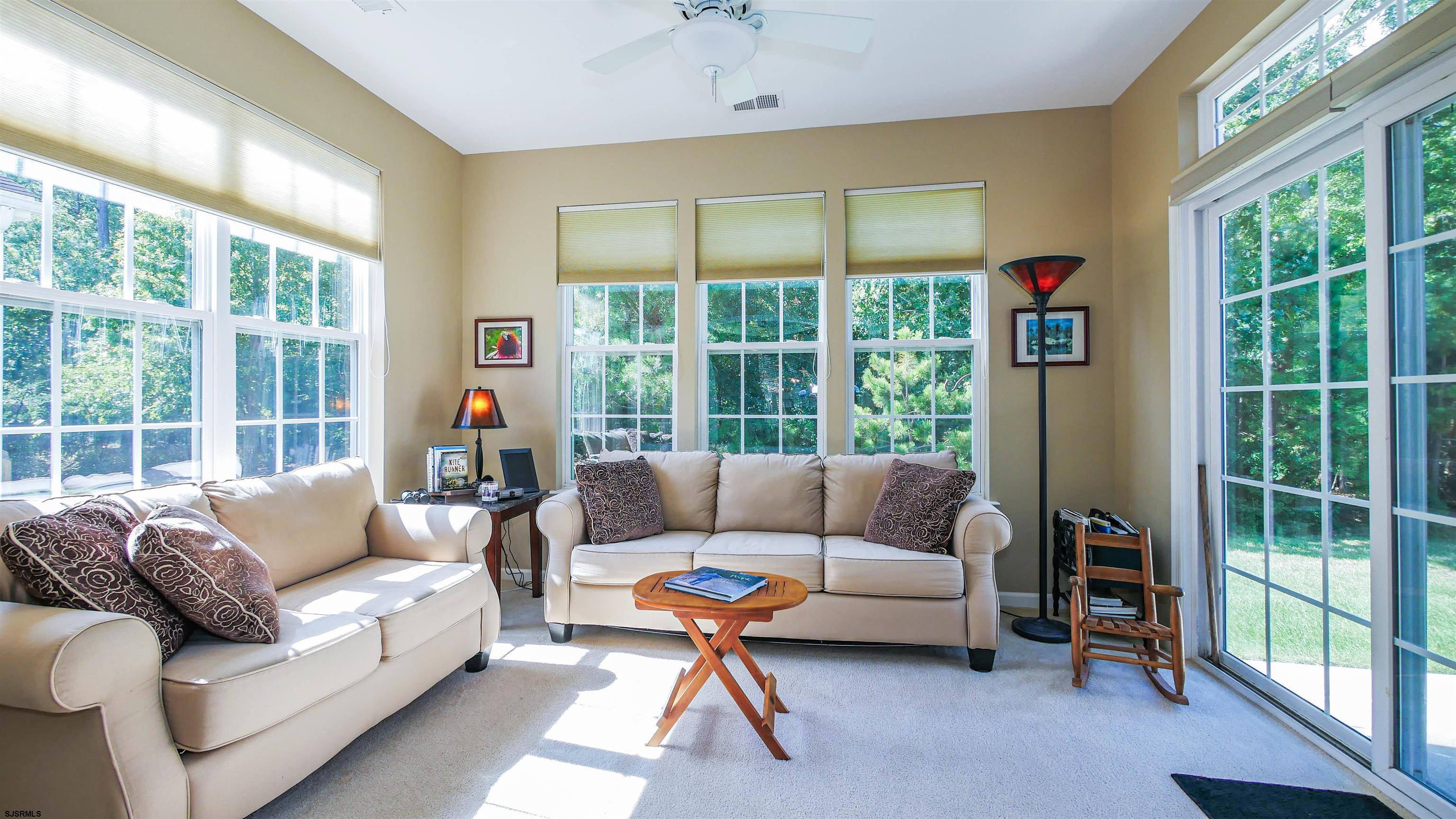 33 Brampton Street Smithville, NJ 08205 - Photo 19 of 37 a living room with furniture and a large window