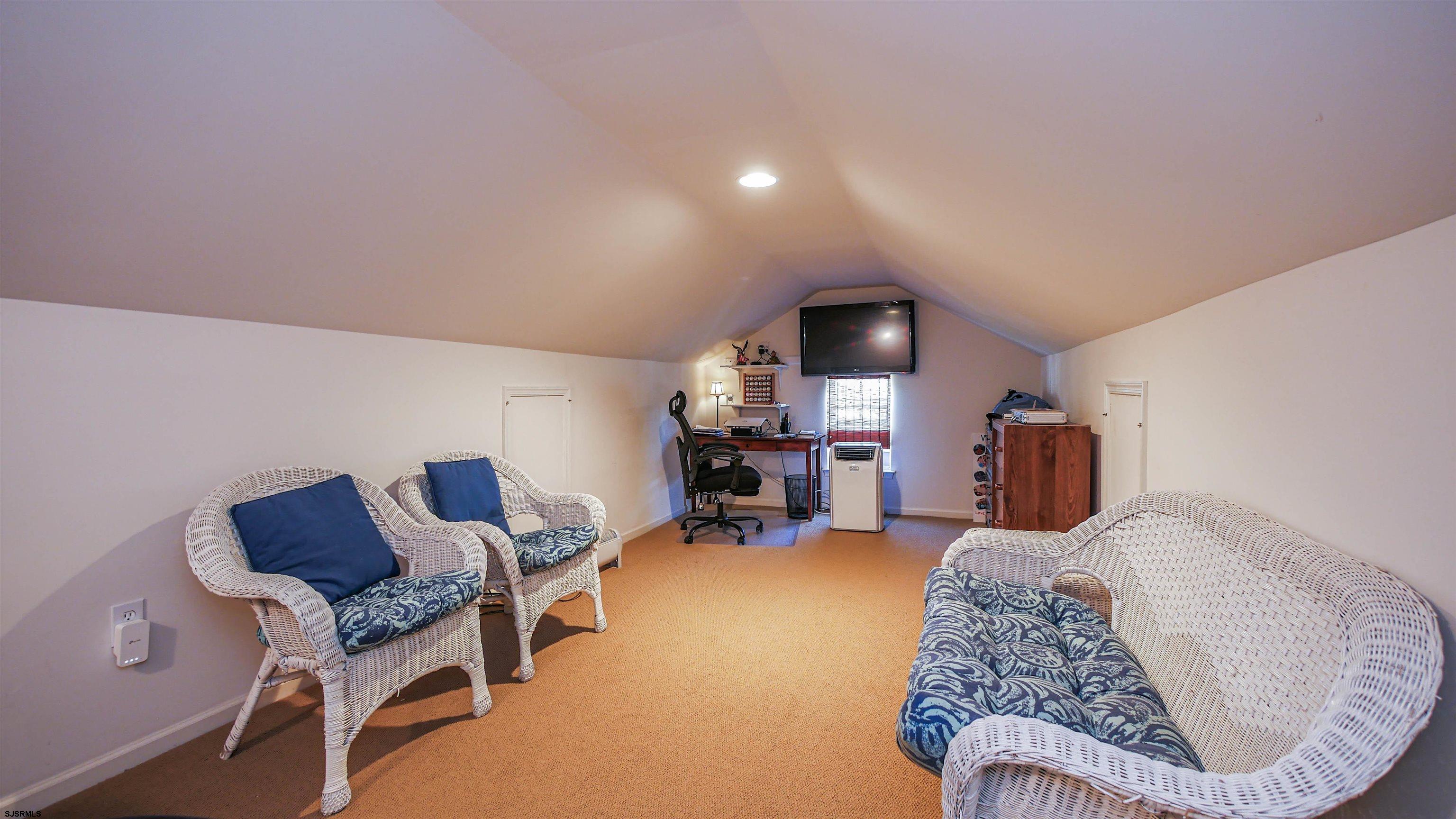 33 Brampton Street Smithville, NJ 08205 - Photo 31 of 37 a living room with furniture and a couch