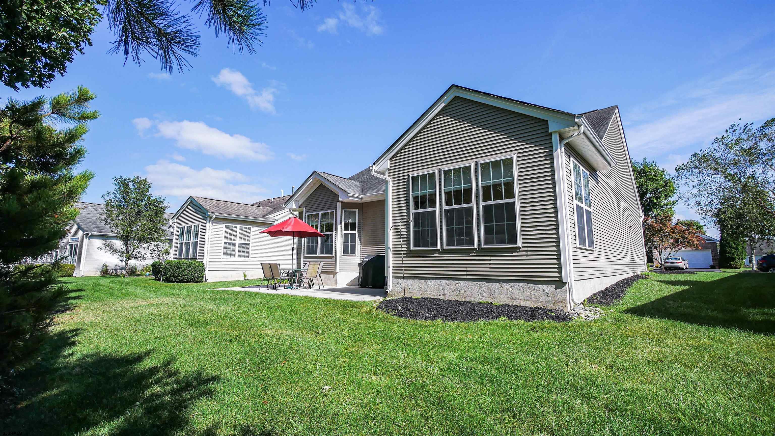 33 Brampton Street Smithville, NJ 08205 - Photo 37 of 37 a front view of house with yard and green space