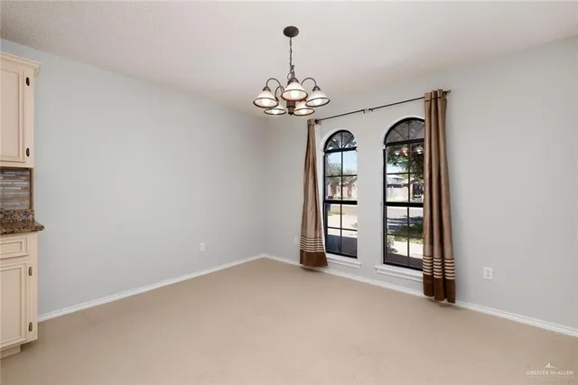 a view of a chandelier with a chandelier fan