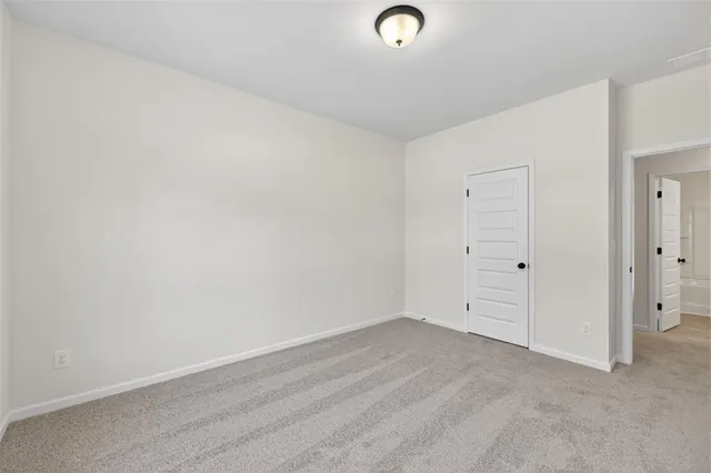 an empty room with white walls