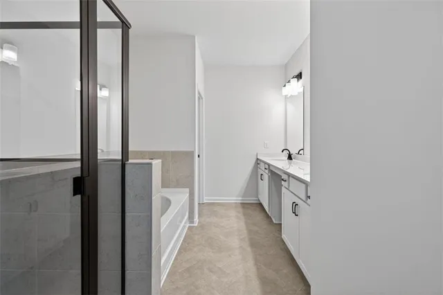 a bathroom with a double vanity sink and a mirror