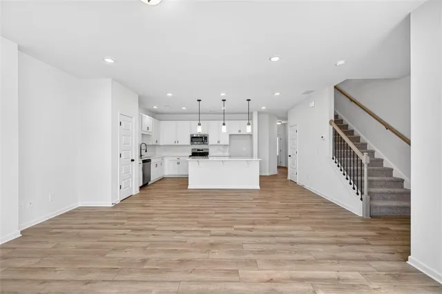 a view of kitchen with wooden floor