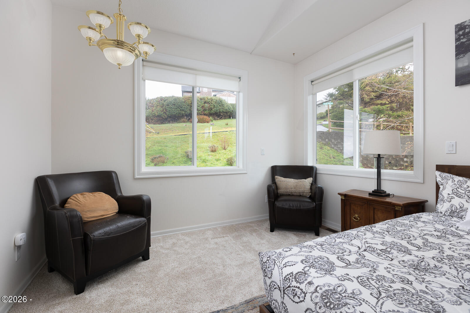 7415 East Summit Road Pacific City, OR 97135 - Photo 16 of 44 a bedroom with a bed couch and window