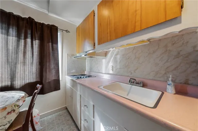 a bathroom with a sink mirror vanity and toilet