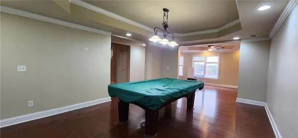 a view of a room with furniture and chandelier