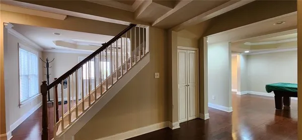 a view of an entryway with wooden floor
