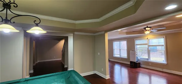 a view of a hardwood & staircase in a room