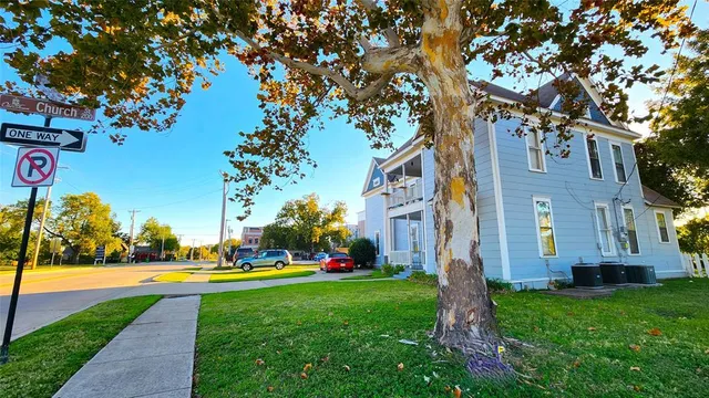 a view of yard with swimming pool and green space