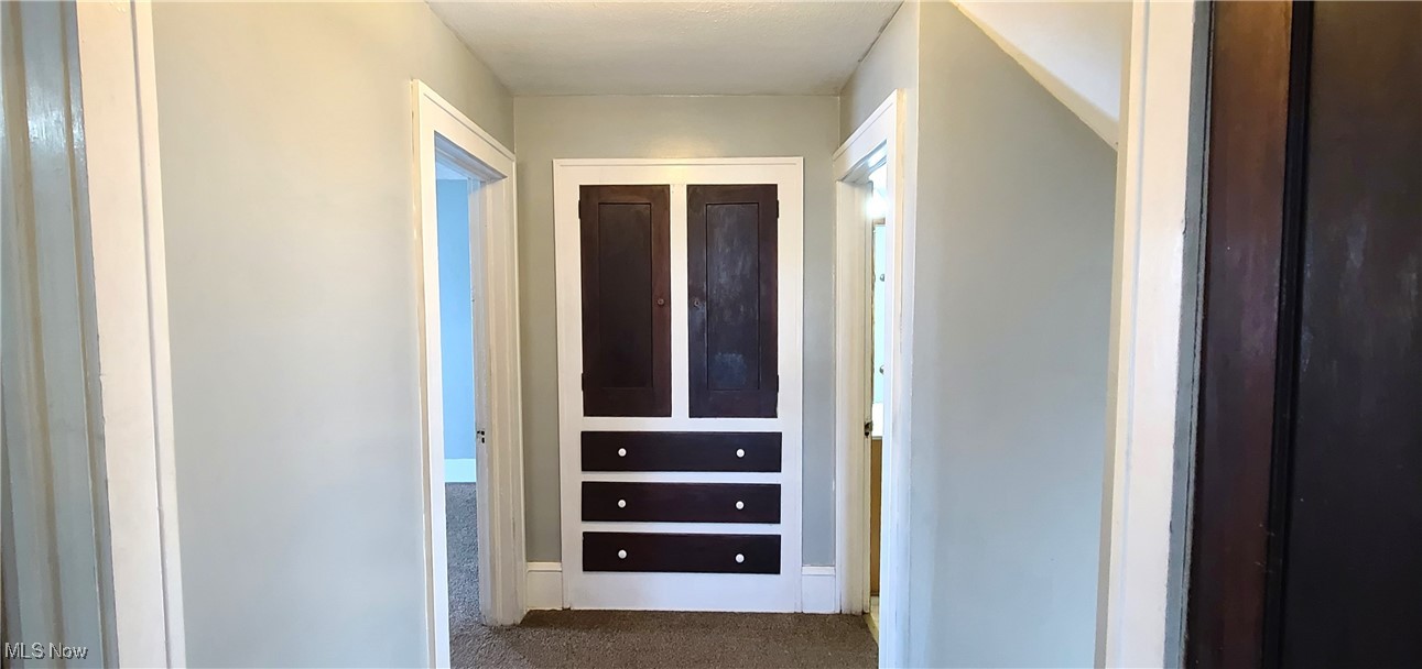 3210 Dryden Court Southwest Canton, OH 44708 - Photo 20 of 24 Hallway featuring built in cabinets