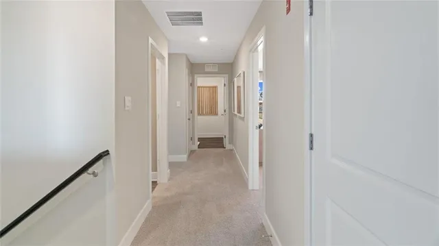 a view of a hallway with a room