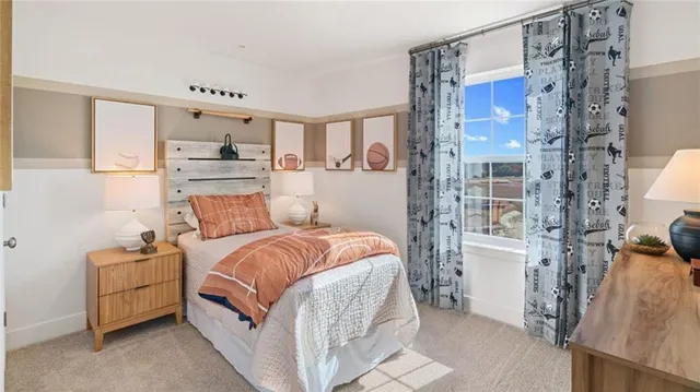 a bed room with a bed and a chair