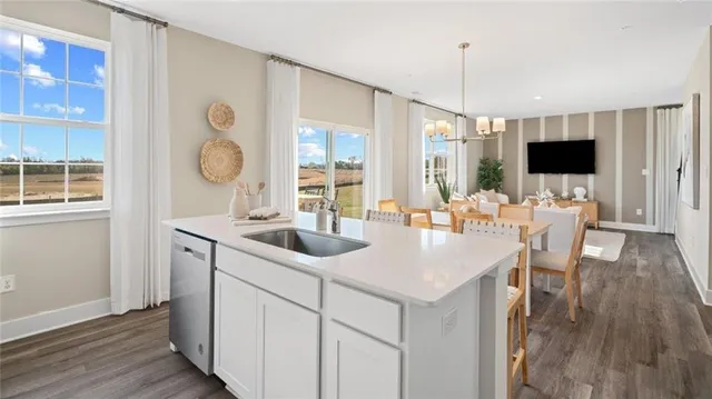 a kitchen with a sink and a refrigerator