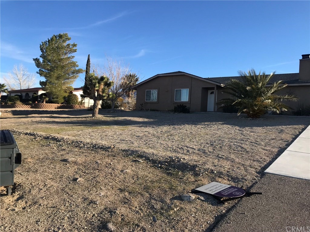 32159 Sapphire Road Lucerne Valley, CA 92356 - Photo 1 of 1 a front view of a house with a yard