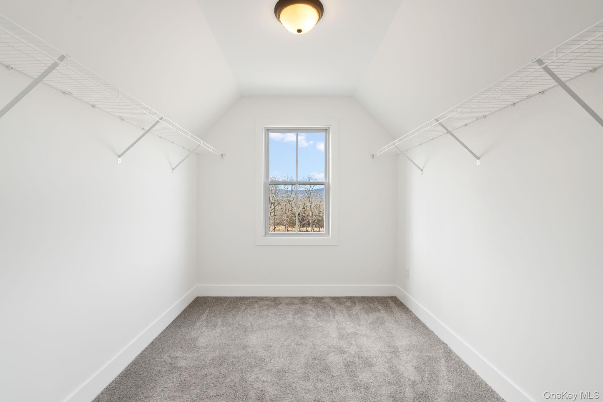 13 Harrier Ridge Drive Wallkill, NY 12589 - Photo 25 of 40 Spacious closet featuring light colored carpet and vaulted ceiling