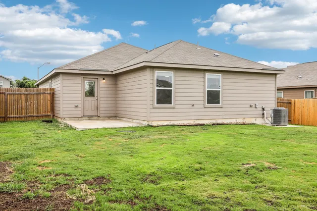 a view of a backyard with plants and a garden