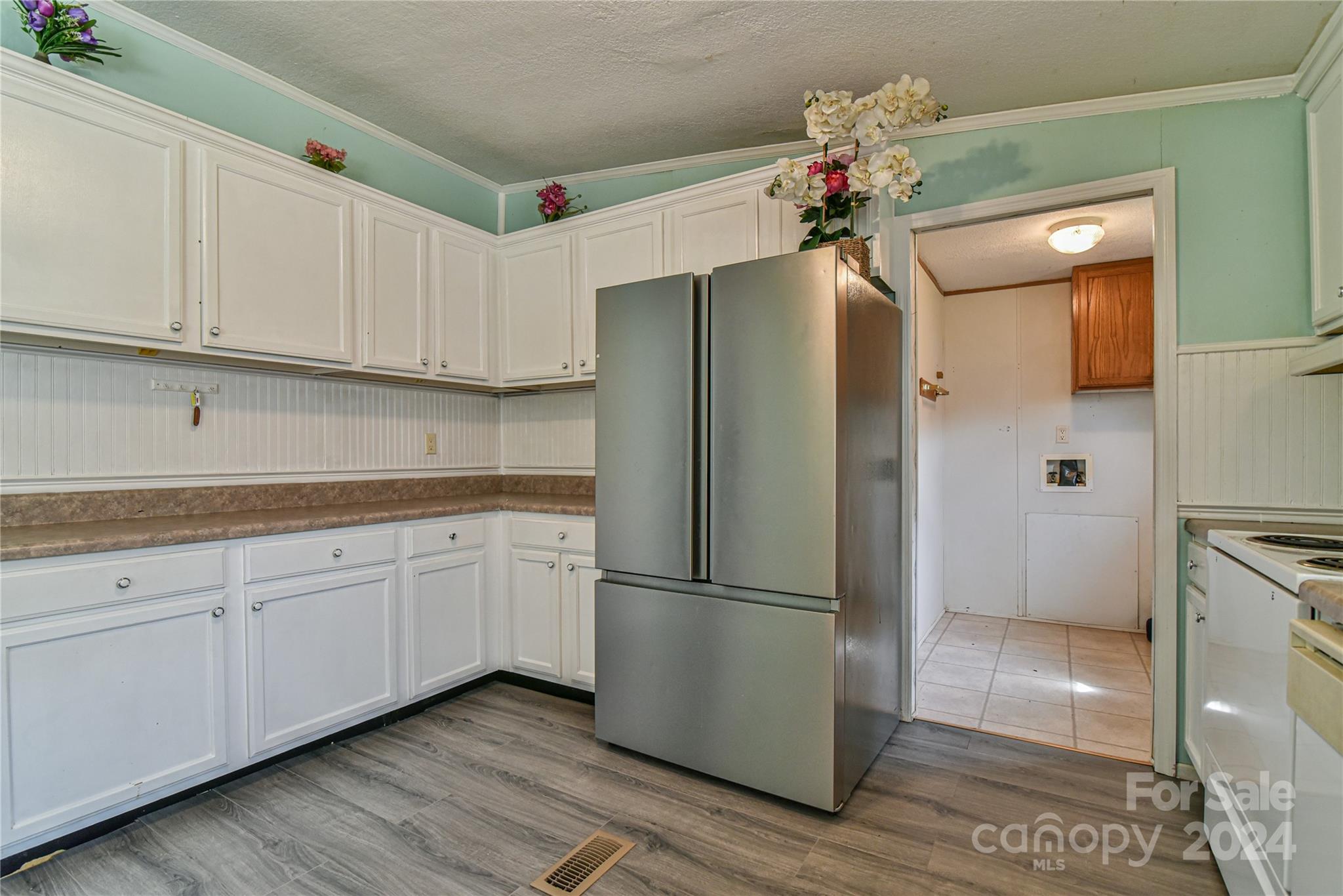204 Gouges Branch Road Leicester, NC 28748 - Photo 7 of 34 a kitchen with a refrigerator sink and cabinets