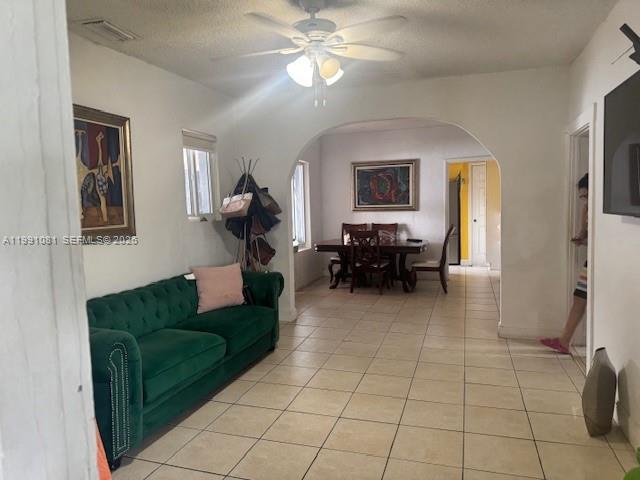 315 Southwest 63rd Avenue Miami, FL 33144 - Photo 2 of 5 a living room with furniture and a chandelier