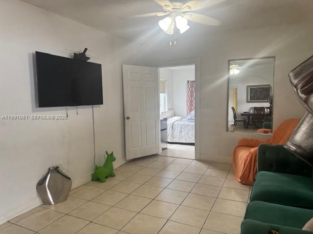 315 Southwest 63rd Avenue Miami, FL 33144 - Photo 3 of 5 a living room with furniture and a flat screen tv