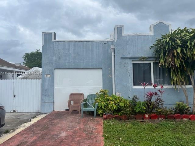 315 Southwest 63rd Avenue Miami, FL 33144 - Photo 5 of 5 a front view of a house with a garden