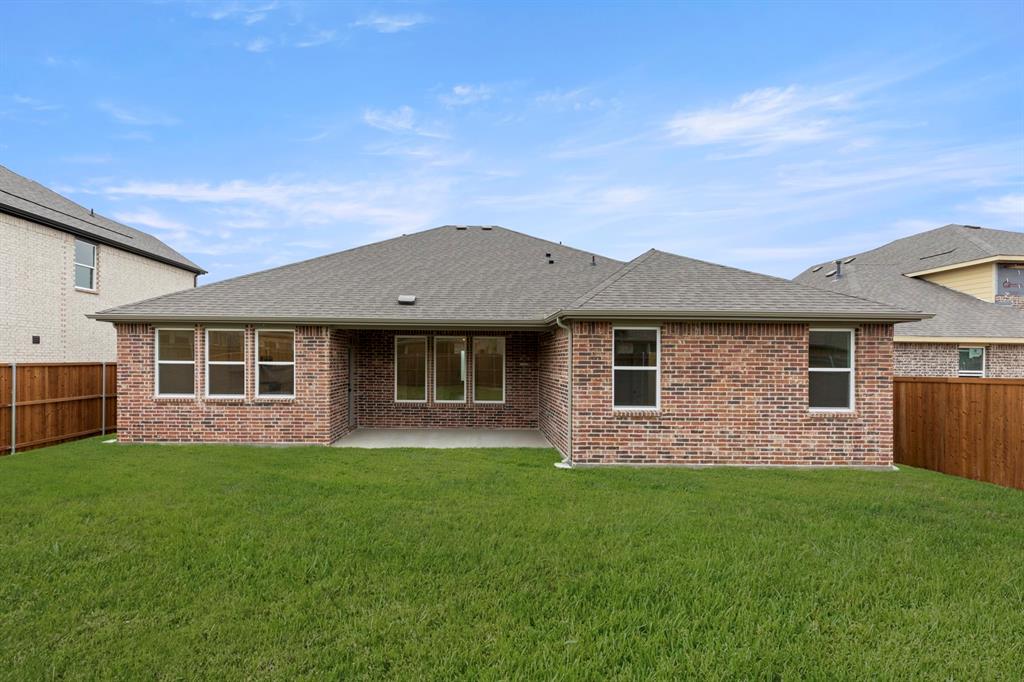 1821 Bachman Lane Forney, TX 75126 - Photo 26 of 27 a front view of a house with a garden