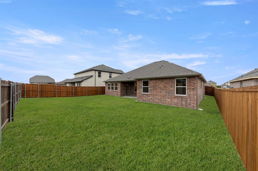 1821 Bachman Lane Forney, TX 75126 - Photo 27 of 27 a front view of a house with garden