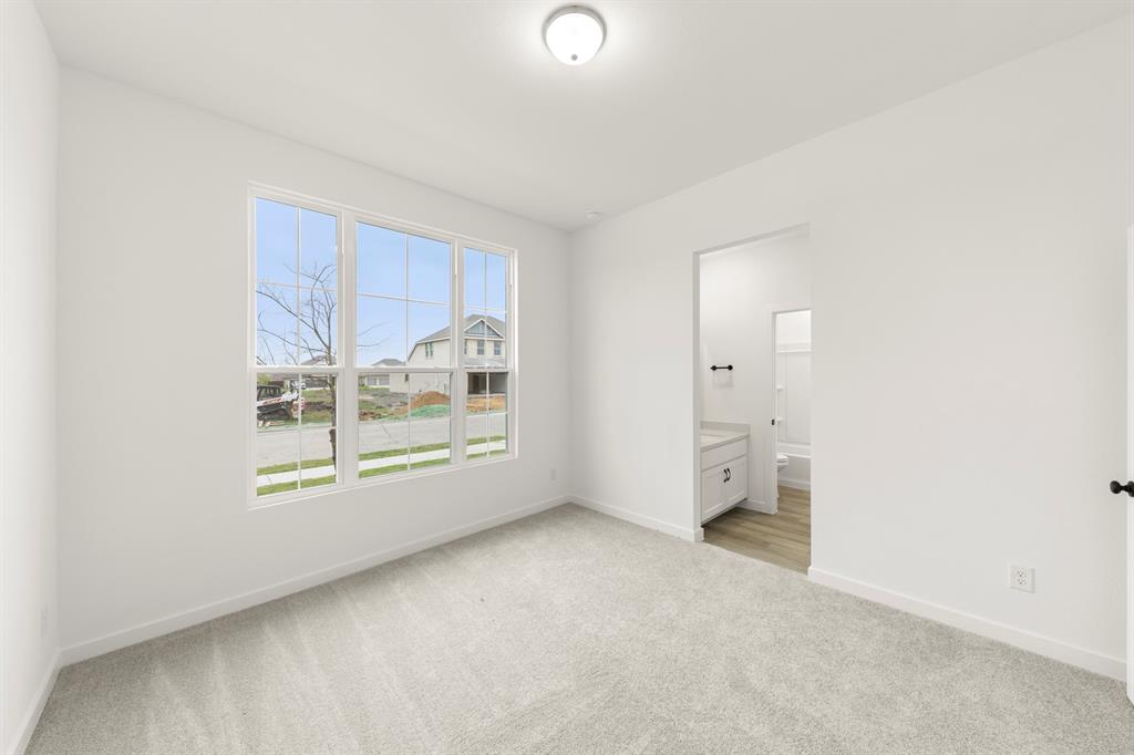 1821 Bachman Lane Forney, TX 75126 - Photo 4 of 27 a view of an empty room with a window