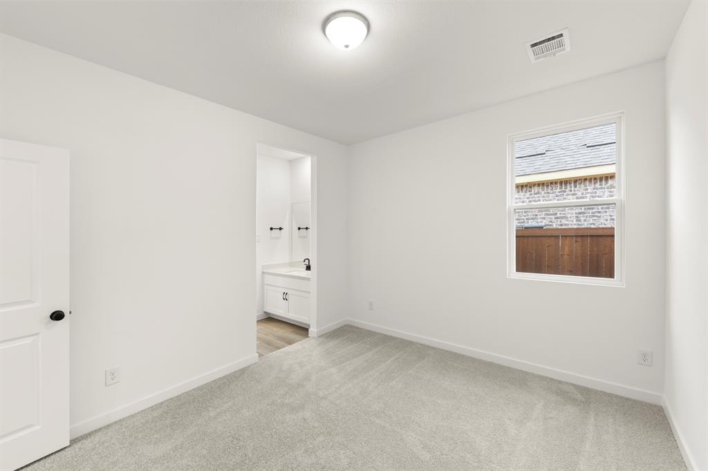 1821 Bachman Lane Forney, TX 75126 - Photo 6 of 27 an empty room with a bathroom