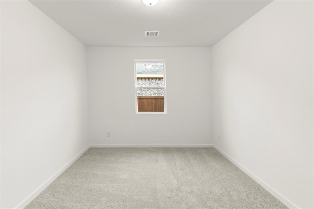1821 Bachman Lane Forney, TX 75126 - Photo 8 of 27 an empty room with a window