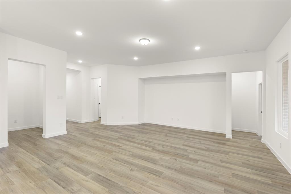 1821 Bachman Lane Forney, TX 75126 - Photo 10 of 27 a view of an empty room with wooden floor