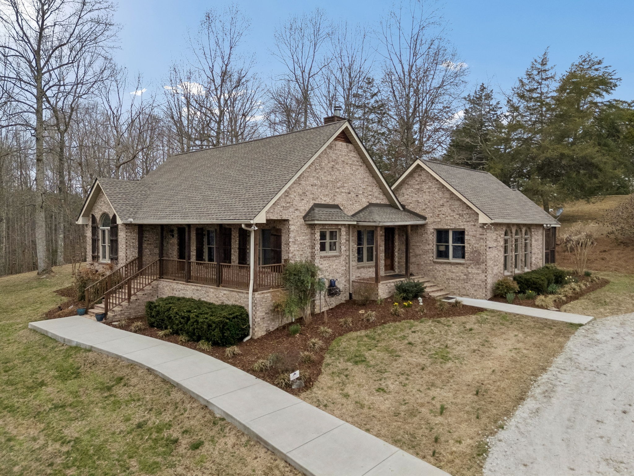 7301 Brush Creek Road Fairview, TN 37062 - Photo 1 of 30 a front view of a house with garden