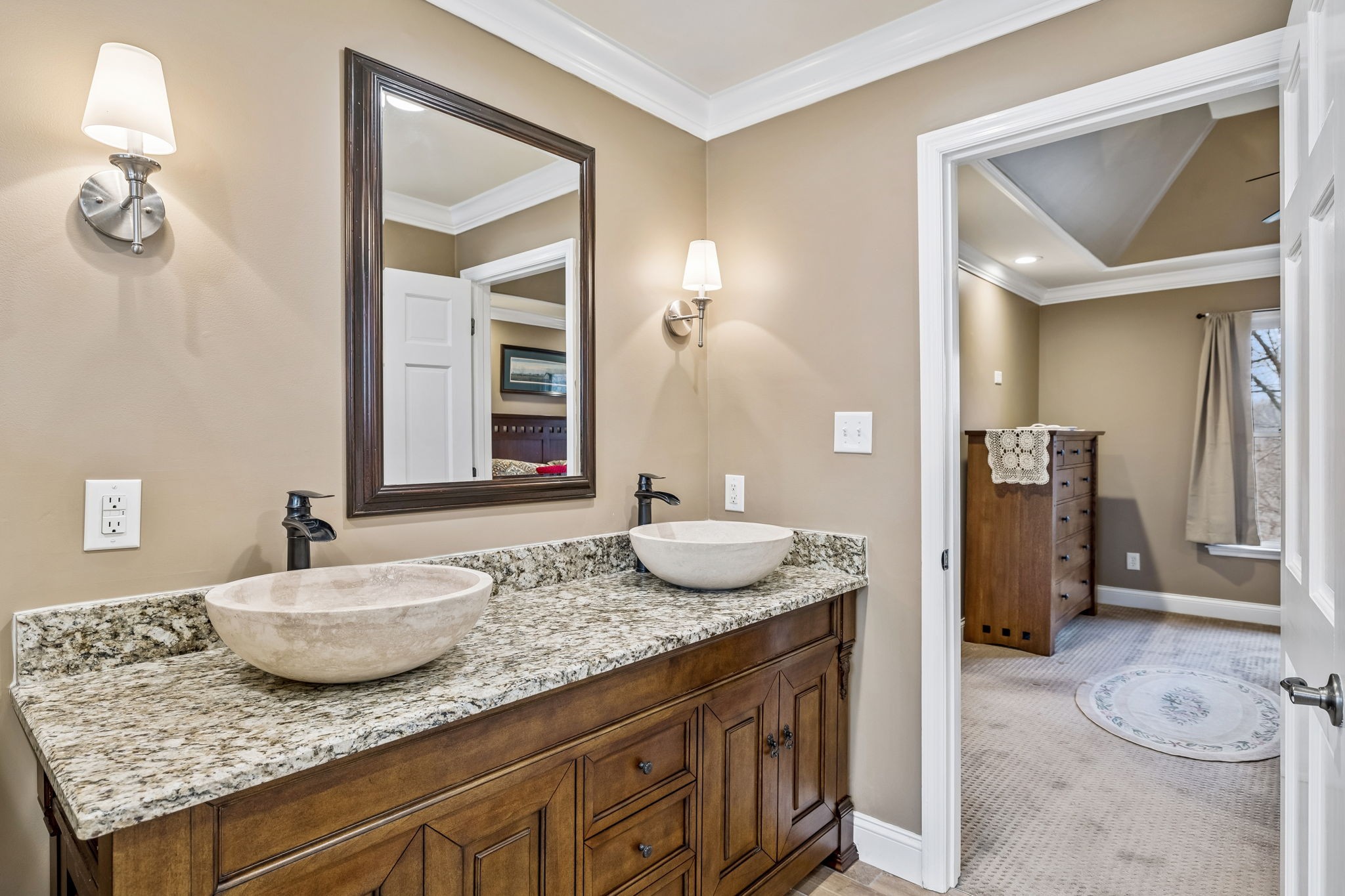 7301 Brush Creek Road Fairview, TN 37062 - Photo 11 of 30 a bathroom with a granite countertop sink and a mirror