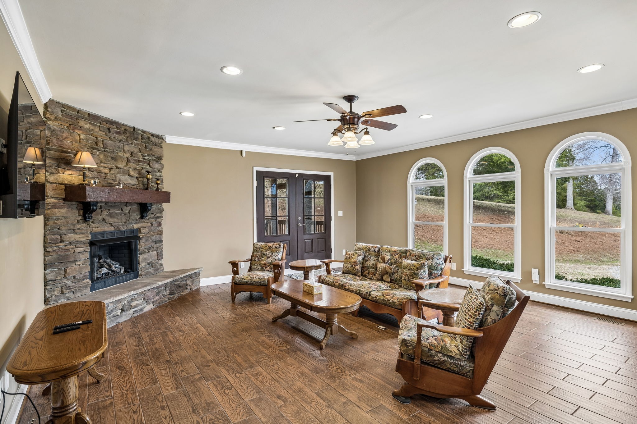 7301 Brush Creek Road Fairview, TN 37062 - Photo 7 of 30 a living room with furniture and a fireplace