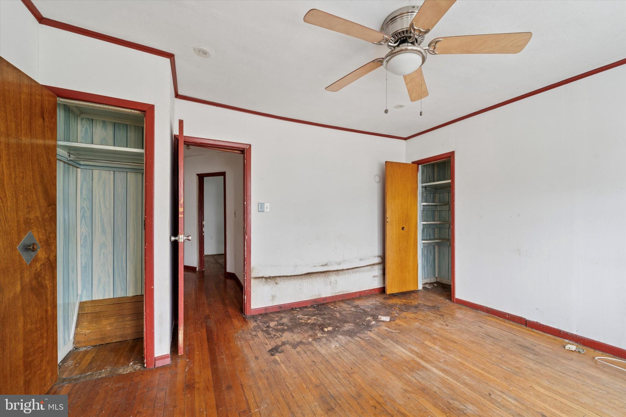 7250 Radbourne Road Upper Darby, PA 19082 - Photo 14 of 15 a view of a livingroom with wooden floor and a ceiling fan