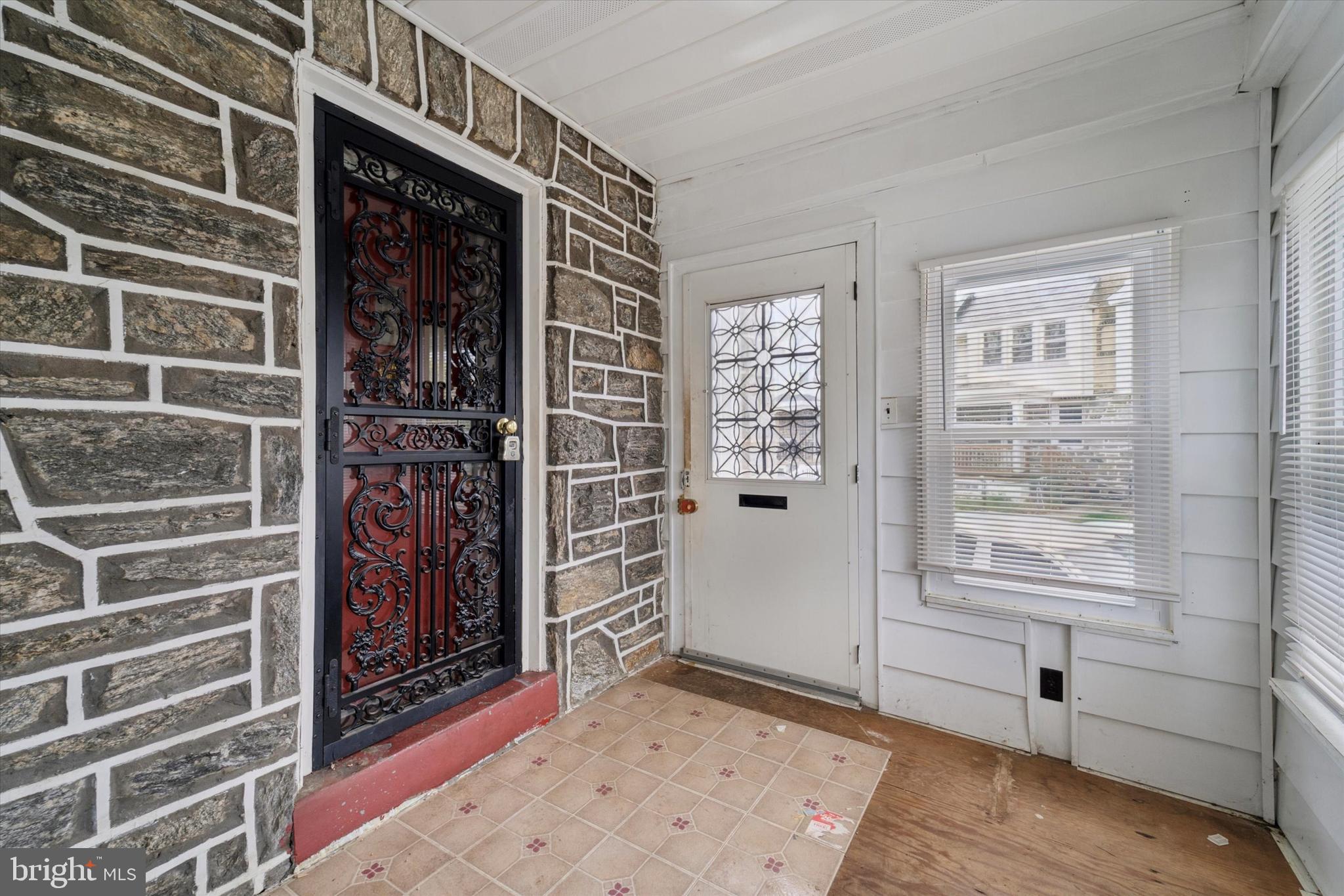 7250 Radbourne Road Upper Darby, PA 19082 - Photo 2 of 15 a view of an entryway with a window
