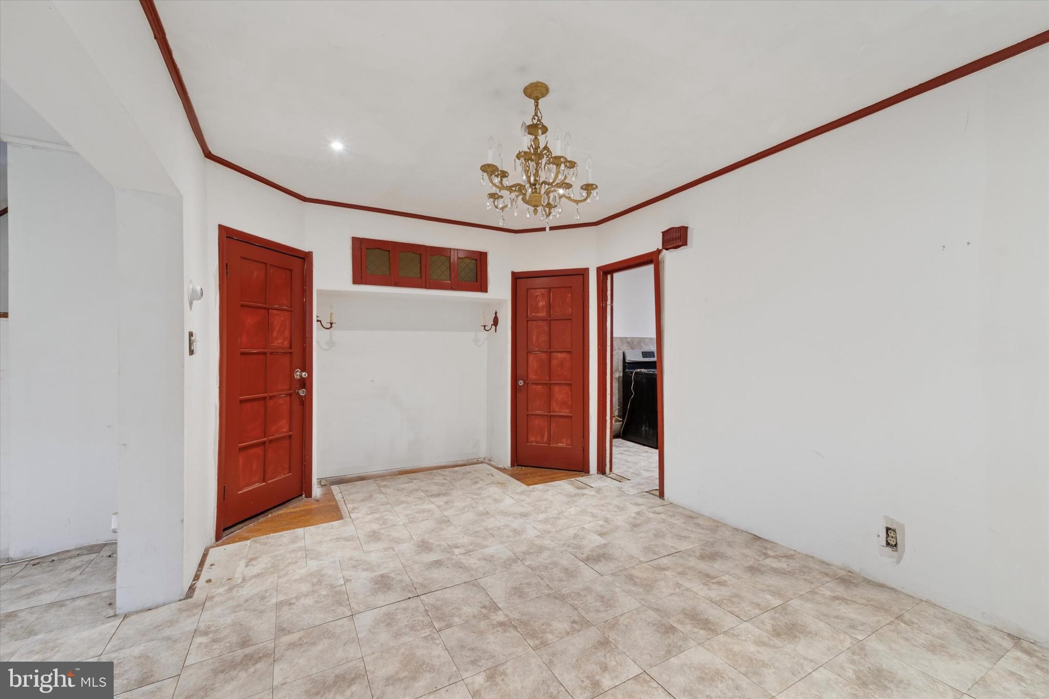 7250 Radbourne Road Upper Darby, PA 19082 - Photo 6 of 15 an empty room with closet and chandelier